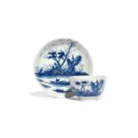 A Worcester blue and white teabowl and saucer c.1755-58, painted with the Gazebo pattern, a small