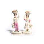 A pair of Staffordshire porcelain figures of children 19th century, possibly Rockingham, each