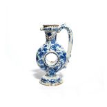 A Delft ring puzzle jug 18th century, the body formed of a flattened hollow ring painted in blue