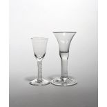 Two wine glasses c.1750-60, one with a bell bowl raised on a thick plain above a folded foot, the