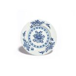 A small London delftware plate c.1730-40, painted in blue with a central spray of peony, the rim