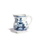 A Lowestoft blue and white cream jug c.1765-70, painted with a pagoda and tree behind a low