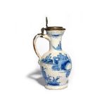 A Delft or German faïence jug or ewer c.1660-80, painted in Chinese transitional style with two