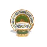 A Sèvres coffee can and saucer dated 1814, painted with a continuous band of flowering convolvulus