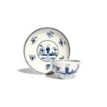 A Worcester blue and white teabowl and saucer c.1765, painted with the Waiting Chinaman pattern, the