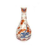 A Delft bottle vase 18th century, the octagonal form richly decorated in blue, red and gilt with a