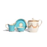 A Worcester teacup and saucer and a milk jug c.1760, the cup and saucer with Warmstry fluting, the