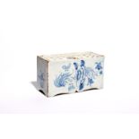 A large delftware flower brick c.1750-60, probably Bristol, simply painted in blue with sprays of