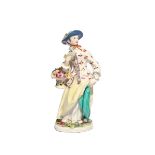 A Bow figure of a Flower Girl c.1755-60, modelled with a basket of flowers suspended from the
