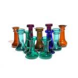 Eleven large glass hyacinth vases 19th/early 20th century, of traditional churn shape, some with a