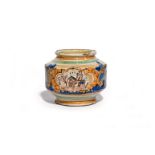 A small Caltagirone maiolica albarello late 17th century, the squat cylindrical sides painted with