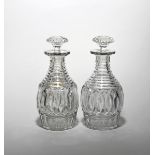 A good pair of cut glass decanters and stoppers early 19th century, the ovoid bodies cut with a wide