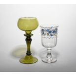 A large green glass ceremonial goblet dated 1882, the shallow rounded bowl engraved with the