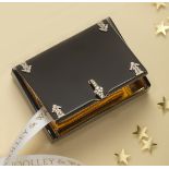 An Art Deco silver gilt rectangular vanity case by Cartier, black enamel decoration overall with