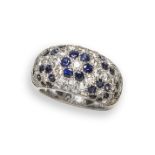 A French sapphire and diamond bombe ring, pave-set with diamonds and flowerhead clusters of
