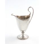 A George III silver cream jug, by Robert Hennell, London 1802, helmet form, beaded borders and