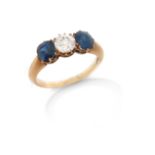 A sapphire and diamond three stone ring, the old circular-cut diamond is set with oval-shaped