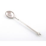 A silver cannon handled basting spoon, by R. Comyns, London 1936, tapering circular handle, with a