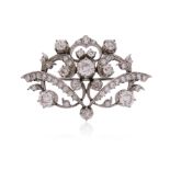A Victorian diamond scroll brooch, set overall with graduated old circular-cut diamonds in silver