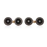 A pair of black enamel and diamond-set gold cufflinks, each circular link centred with a circular-