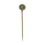 An emerald and diamond stickpin, the cabochon emerald is set within a surround of old cushion-shaped