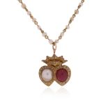 A Victorian ruby and pearl double heart pendant, set with a half pearl and a cabochon ruby within