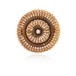 A 19th century circular gold brooch, of openwork design and centred with a seed pearl, with gold