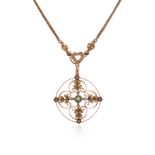 An Edwardian gem-set gold pendant, the openwork circular pendant set with a circular-cut peridot and