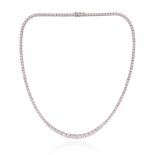 A diamond line necklace, set with graduated round brilliant-cut diamonds in white gold, diamonds