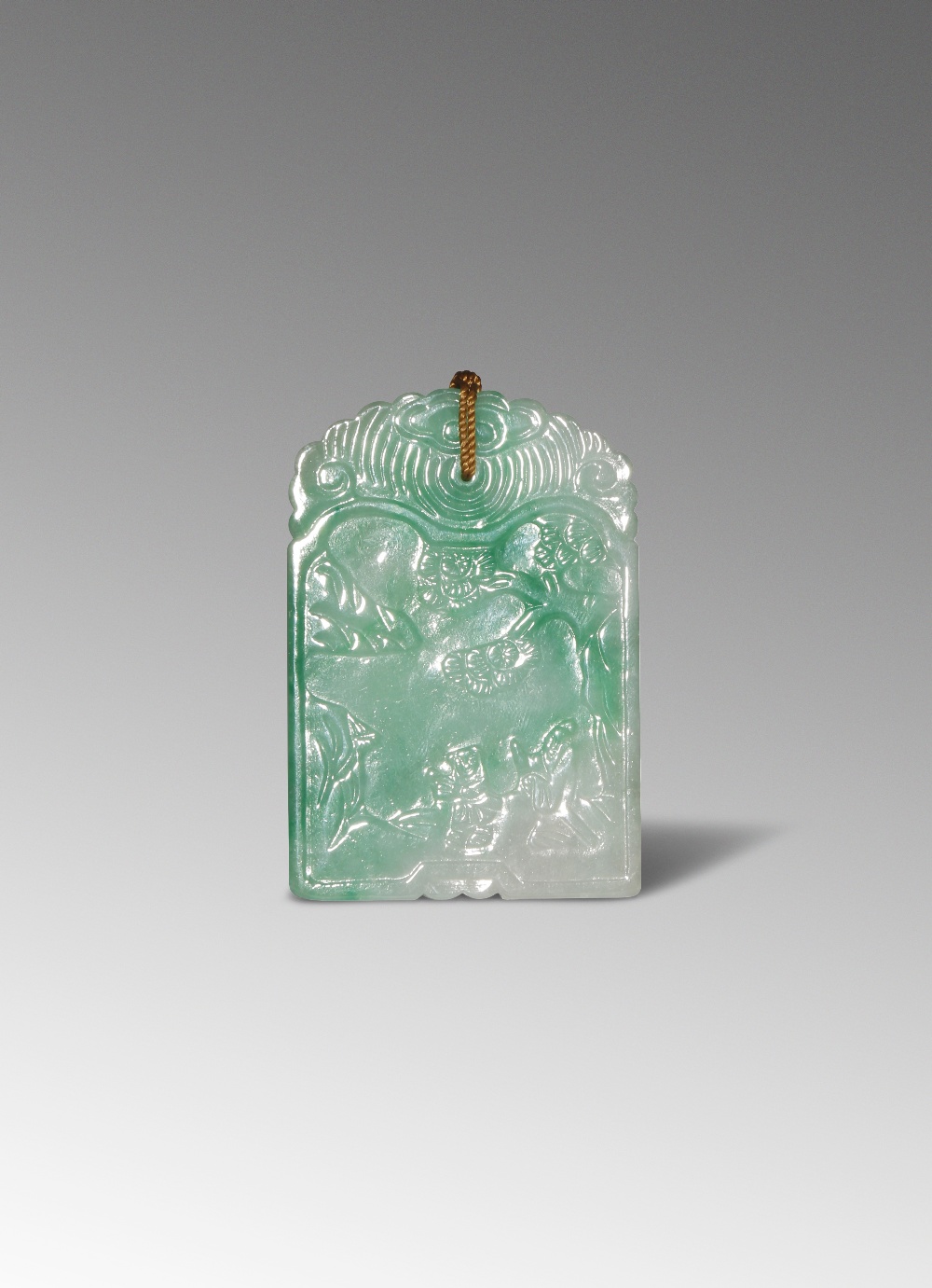 A CHINESE APPLE GREEN JADEITE RECTANGULAR PENDANT QING DYNASTY OR LATER Carved in low relief to