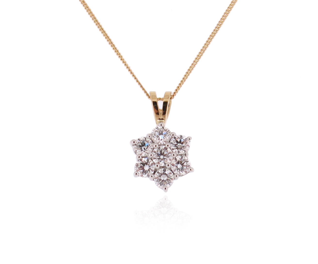 A diamond cluster pendant, set with round brilliant-cut diamonds in two-colour gold, on a fine-