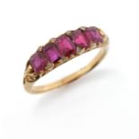 A late 19th century ruby five stone ring, set with diamond pointers in carved and pierced yellow