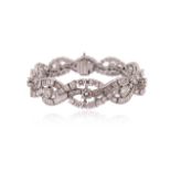 A diamond scroll bracelet,