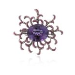 An amethyst pink sapphire and diamond-set scroll brooch pendant by Fei Liu, centred with an oval-