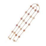 A zircon-set gold long chain, the round brilliant-cut multicoloured zircons are set in spectacle