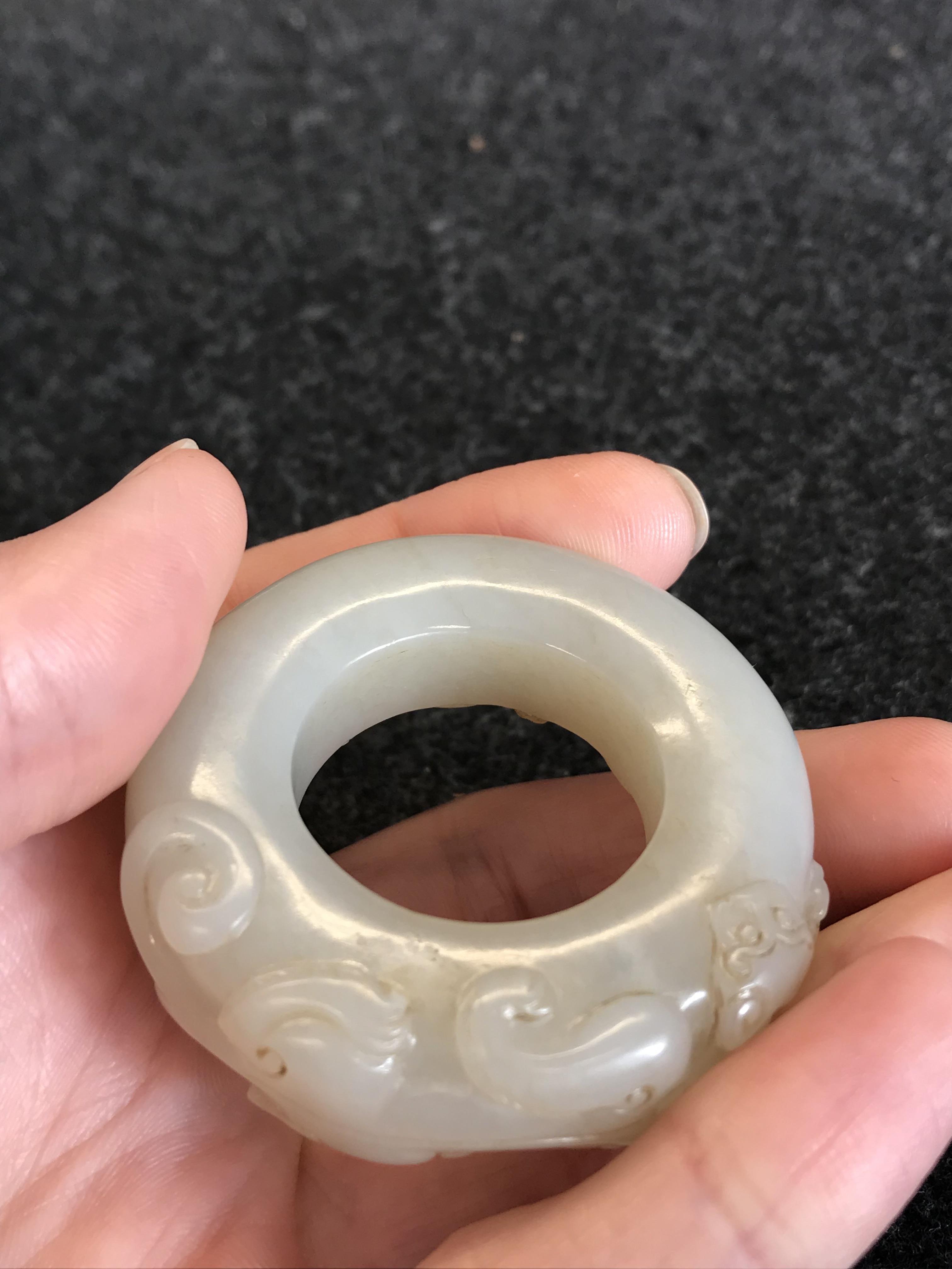 A CHINESE PALE CELADON JADE 'CHILONG' HUAN QING DYNASTY OR LATER Formed as a disc, carved in - Image 13 of 14