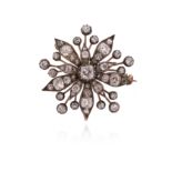 A late Victorian diamond snowflake brooch, set overall with graduated cushion-shaped diamonds in