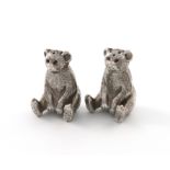 A matched pair of Edwardian novelty silver bear pepper pots, one by Henry Williamson Ltd, the