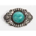 A Kay Bojesen Solvsmedie silver and Amazonite brooch, oval cast in relief with flower border, set