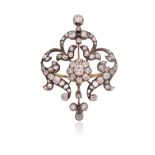 A Victorian diamond-set scroll brooch pendant, of foliate scroll design and set with graduated old