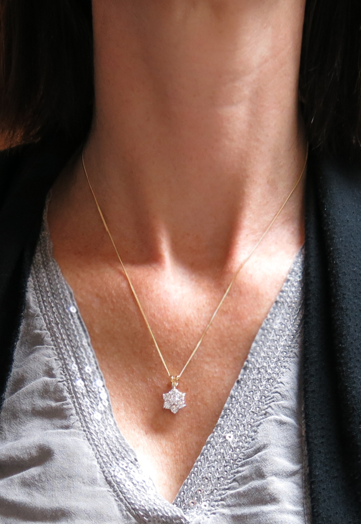 A diamond cluster pendant, set with round brilliant-cut diamonds in two-colour gold, on a fine- - Image 4 of 4