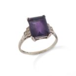 An amethyst and diamond ring, the rectangular-shaped amethyst is set with three single-cut