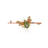 An Edwardian gold insect brooch, the stylised bee set with seed pearls and demantoid garnets in