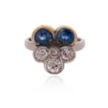 A sapphire and diamond pansy ring, set with graduated circular-cut sapphires and diamonds in