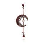A Victorian ruby and diamond crescent brooch, set with graduated rubies and diamonds and a seed