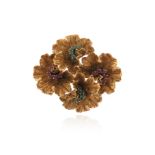 A gem-set gold foliate brooch, set with clusters of rubies and emeralds, 3.8cm wide, 13g Condition