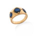 A sapphire three stone ring, the graduated oval-shaped sapphires set in rhomboid four claw yellow