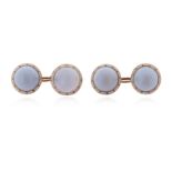 A pair of chalcedony and enamel gold cufflinks, the blue chalcedony cabochons set within a