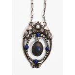 A Georg Jensen silver and lapis pendant necklace designed by Georg Jensen, model no. 826, pierced