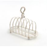 A Victorian silver seven-bar toast rack, by Martin, Hall and Company, London 1875, shaped